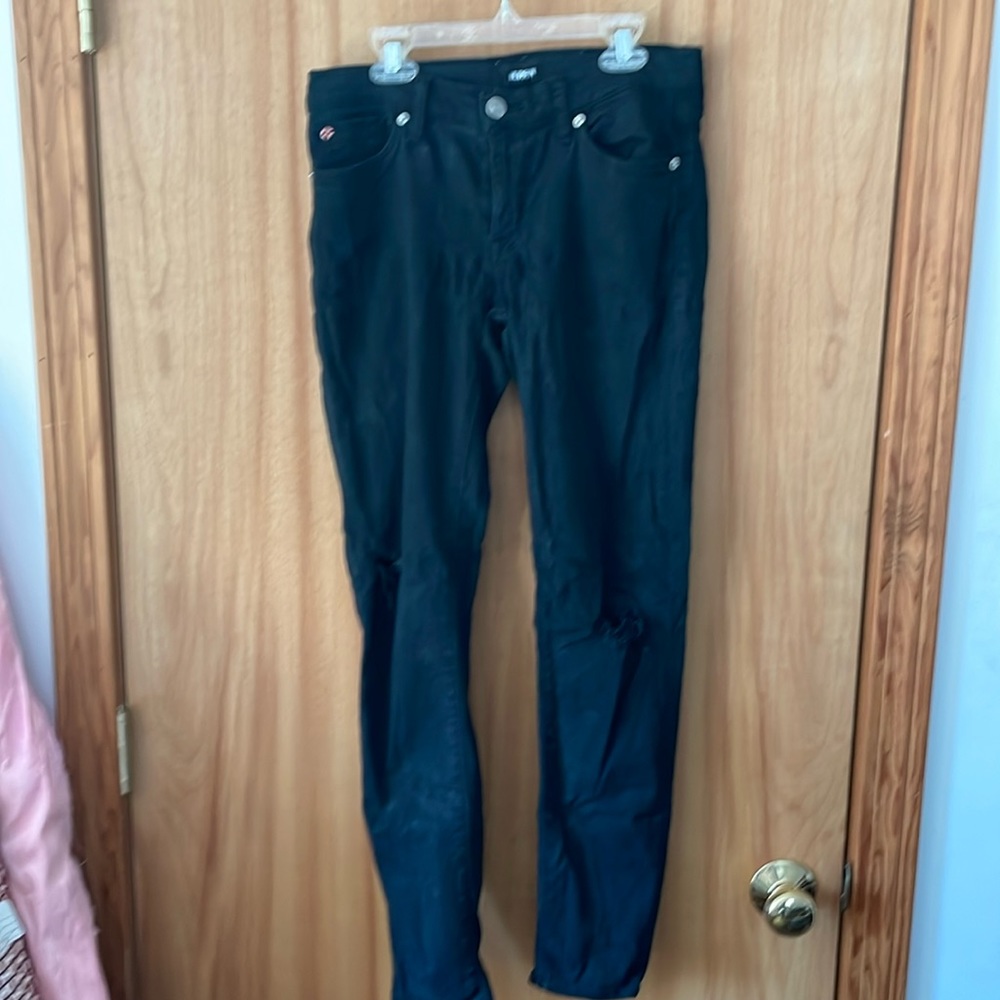 Hudson black. Fashionably ripped skinny jeans.